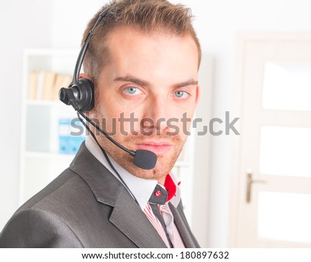 young Telephone Operator with a headset in call center