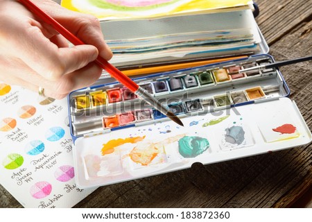 Professional watercolor aquarell paints in box with brush - stock photo