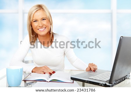 Beautiful businesswoman working or studying with laptop