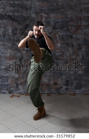 Portrait of man practice martial arts - high kick