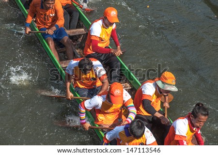 PATUMTHANI, THAILAND - OCT 28: Top view of the rowing teams in full speed during Thai Long-tailed Boat Competition for Royal Championship Cup on October 28, 2012 in Rangsit, Pathumthani,Thailand.