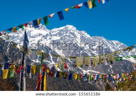 Himalayan Range with snow clad, and prayer flags in Lachen, North Sikkim, India.