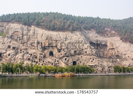 Luoyang,China - OCT 22: Visitors at Longmen grottoes on October 22, 2013.It is one of the four notable grottoes in Luoyang,Henan,China . A UNESCO World Heritage Site.