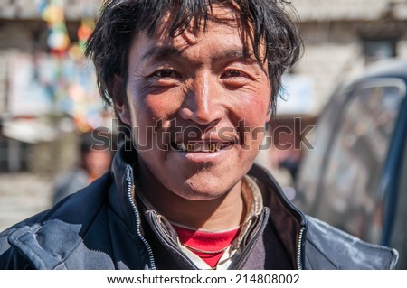 Daocheng, Sichuan,China - October 20,2008 :  An unidentified tibetan  Chinese man at the country town of Daocheng, Sichuan Province, Chinese Tibetan people are an ethnic group native to Tibet.