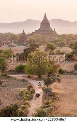 Bagan,Myanmar-March 18,2011: Sunset view plain of temple with horse carriages at Bagan ancient city located in the Mandalay Region of Burma, Myanma.