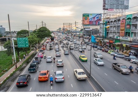 Pathumthani,Thailand-August 16,2014 : Evening busy traffic in motion blur car at Ransit road in Pathumthani , Thailand.
