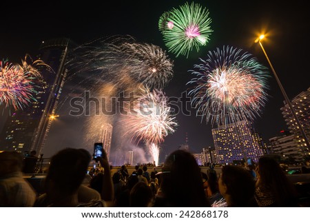 Bangkok,Thailand - January 01,2015 : The people looking the happy new year 2015 exploding fireworks on Taksin bridge in Bangkok,Thailand.