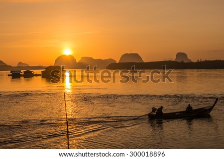 Phang-Nga Thailand - April 18,2015 : Thai fisherman on local fishing boat at Samchong fishing village on sunrise in Phang-Nga,Thailand.