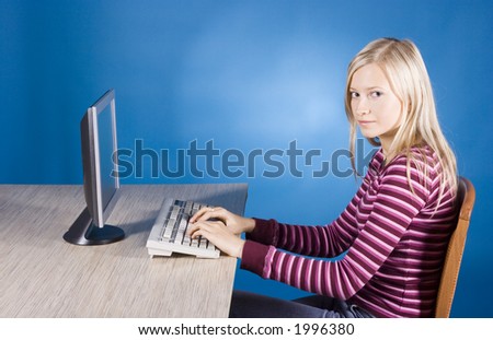 young blonde woman at the computer (blue background)