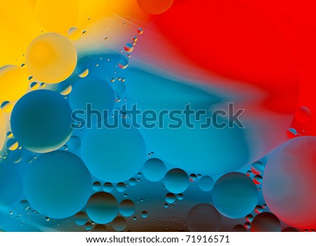 Oil Drops in Water on a Coloured Background