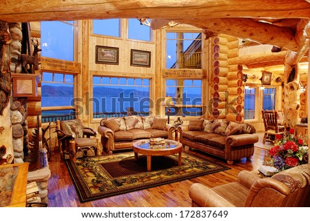 Henry\'s Lake, Idaho, USA Jul. 28, 2011 The interior of a residential log cabin in the mountains. The cabin is constructed with Eastern red cedar, giving a warm colored light to the interior.