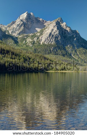 The majestic Sawtooth mountains reflected in Redfish Lake in central Idaho