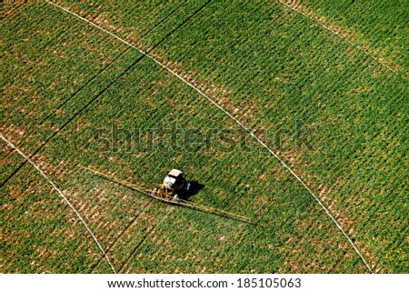 An aerial view of an agricultural crop sprayer
