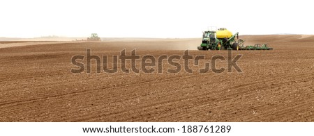Rexburg, Idaho, USA Apr. 4, 2012  Farm machinery planting wheat in the fertile farm fields of  Idaho
