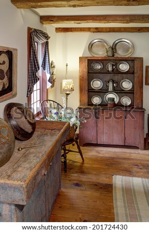 The interior of a primitive colonial style reproduction home, with antiques from the 18th century