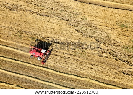 Shelly, Idaho, USA Aug. 16, 2014 An aerial view of farm machinery in the field harvesting wheat