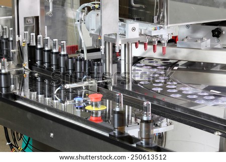 Pocatello, Idaho, USA  June 18, 2012 A machine putting lipstick in tubes in a cosmetics factory.