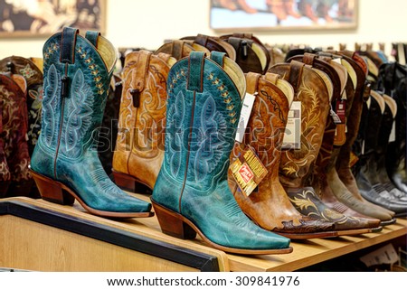 Idaho Falls, Idaho, USA, Aug. 17, 2013 Rows of shelves filled with new cowboy boots for sale.
