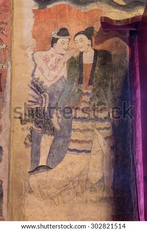 NAN,THAILAND July 29: Thailand\'s famous ancient wall murals called Pu Man, Ya Man which appears on the wall paintings, in Tai Lue style on July 29,2015. Nan,Thailand.