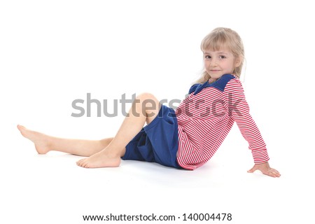 Studio photo of adorable little girl in a striped blouse and knickerbockers