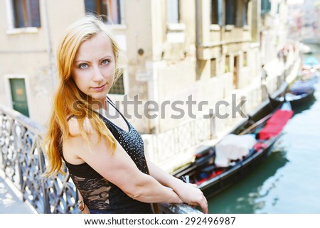 young woman amongst  historic houses and canals in Veniceyoung woman amongst  historic houses and canals in Venice