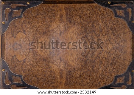 old background of wooden plate with metal corners