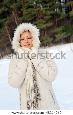 pretty young woman wearing winter outfit with fur