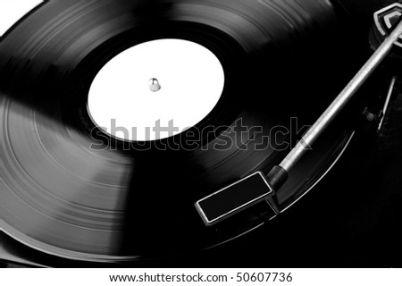 Vinyl record spinning on turntable close up