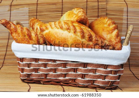 delicious fresh meat pies in  basket