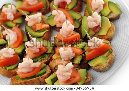 sandwiches  garnish with shrimps, avokado and lettuce close up, snack