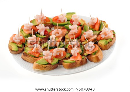 sandwiches  garnish with shrimps, avokado and lettuce on plate, snack