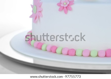 birthday cake with white frosting and flowers of cream