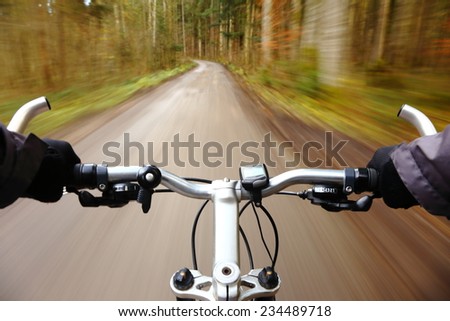 man on bicycle race is driving fast
