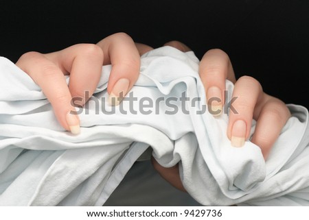 Female hands grabbing a towel
