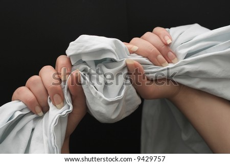 Female hands grabbing a towel