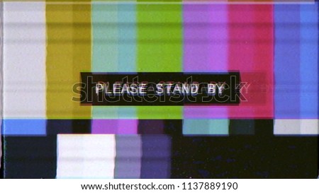 A distorted tv transmission: a noisy signal of SMPTE color bars (a television screen test pattern) with the text Please Stand By.
 Foto d'archivio © 