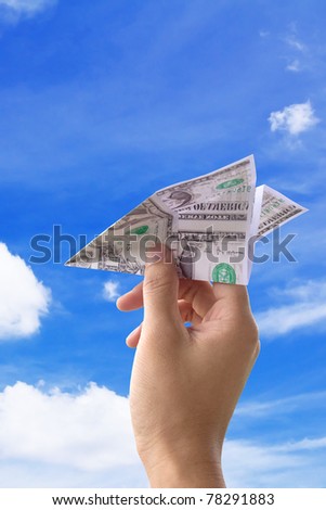 concept image Hand throwing the money paper airplane