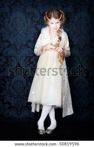 beautiful little girl in princess dress with long hair, studio set