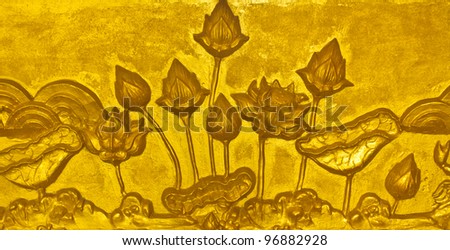 Walls decorated with golden lotus stucco