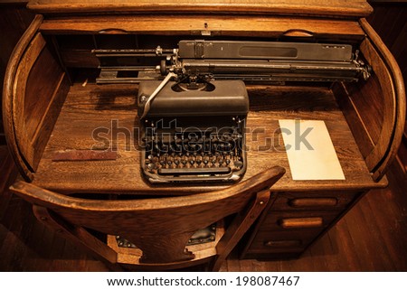 Antique typewriter on an old wooden desk
