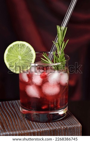 Similar – Image, Stock Photo Glass of pomegranate margarita with flower blooms near near feathers