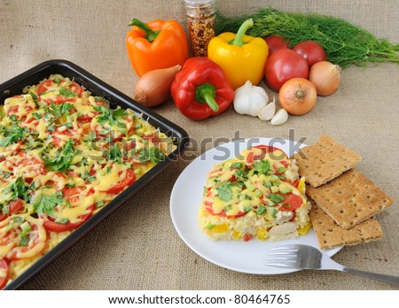 Rice casserole with vegetables Chicken fillet with tomato and cheese