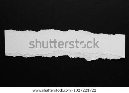 piece of torn paper isolated on black Foto stock © 