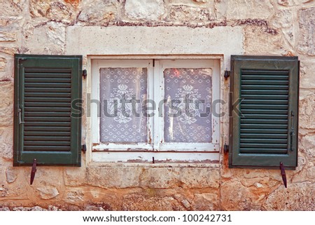 window with shutter and net curtain, Zakynthos island, Greece