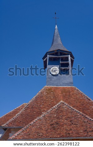 Tower with clock in medieval parish church in Champagne, France