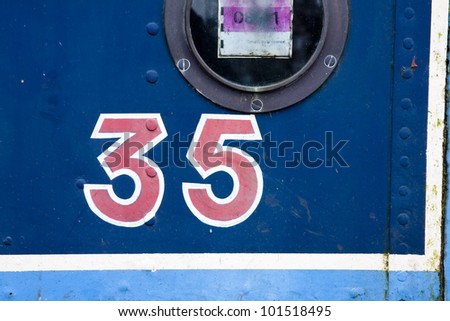 Number 35 painted on side of a narrow boat
