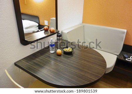 Corner table with lunch bowl, drinks and fruits