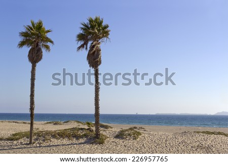 Distant Channel Islands and ocean shore oil rigs as seen from Mandalay Beach, California