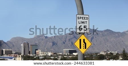 Approaching desert city of Tucson downtown with 65 miles per hour speed limit and narrow road ahead, Arizona, American Southwest