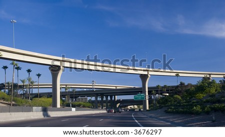 Maze Of Highway Interchange Ramps And Palms Against Blue Sky Stock ...